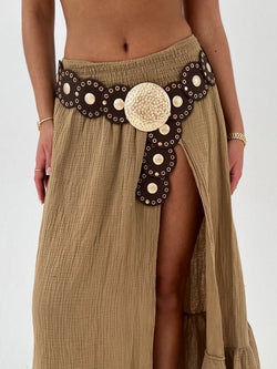 Beige skirt with decorative belt on a white background