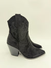 Black suede ankle boot with decorative pattern on a white background