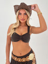 Woman wearing a brown cowboy hat and matching outfit on a white background
